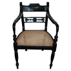 Ebony Armchair with Carved Back and Cane Seat