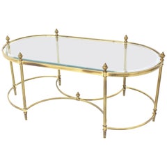 Oval Glass and Brass Coffee Table with Finials Circular Base Stretchers