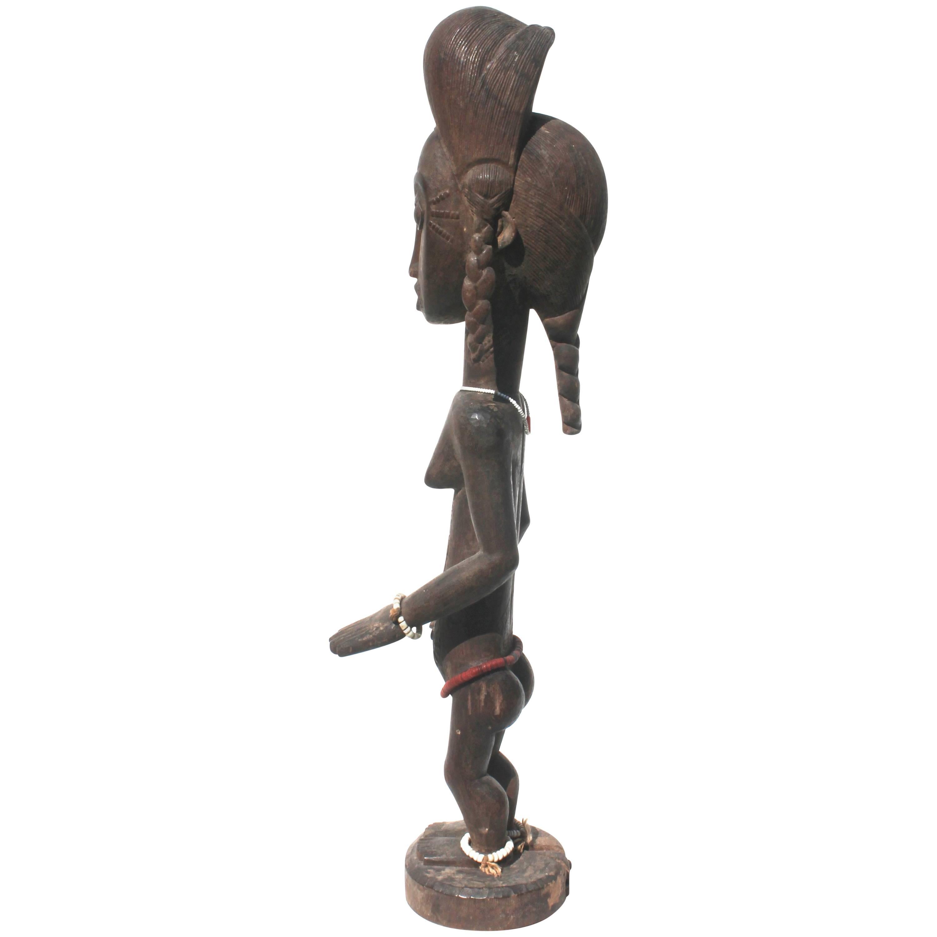 Figure féminine en bois sculpté Baule, sculpture africaine, provenance de Sotheby's en vente