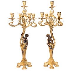 Pair of Rococo Gilt Bronze Candelabra's with Gilt Silver Figures