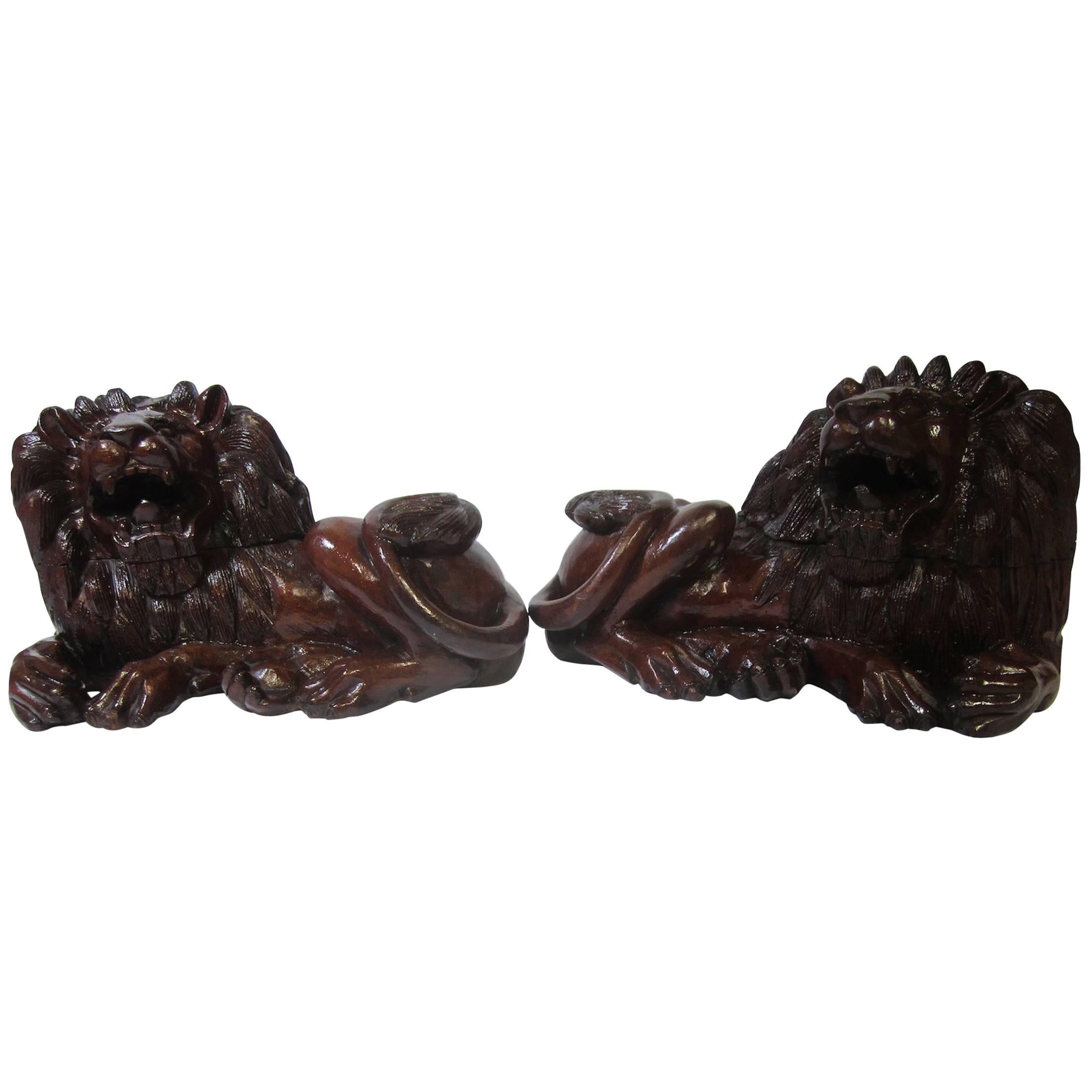 Pair of Carved Hard Wood African Lions For Sale