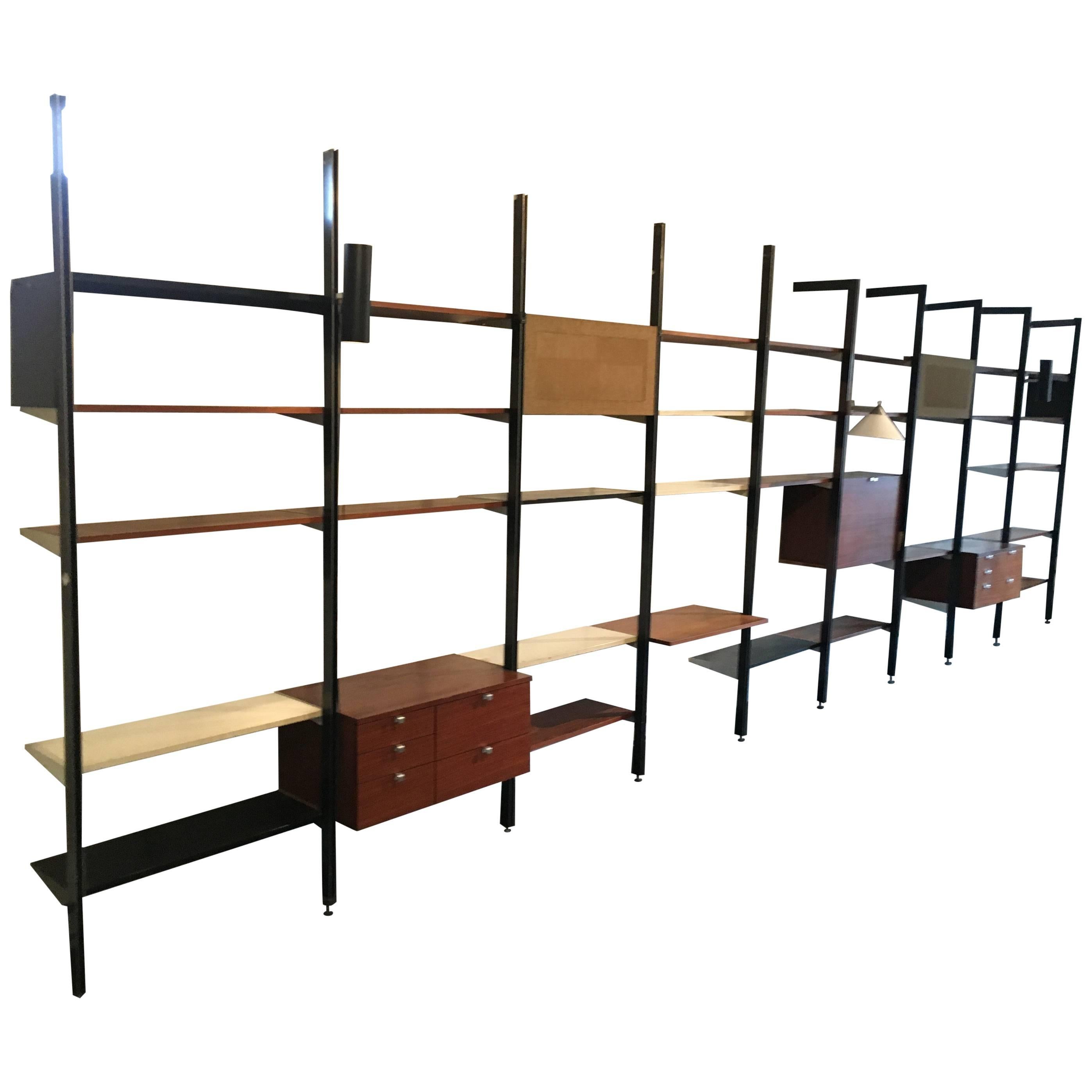 Three bay CSS, designed by George Nelson for Herman Miller,
walnut shelves an cabinets.

Bright Lyons specializes in George Nelson's CSS storage system of 1959. We currently have several bays available with many different cabinet, lighting, and