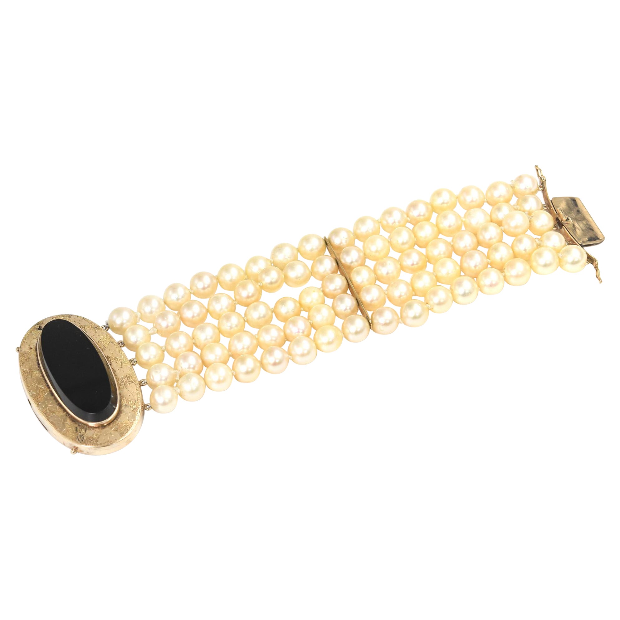 Wide Multi-Strand Cultured Pearl Bracelet with Onyx and Etched Leaf Gold Clasp