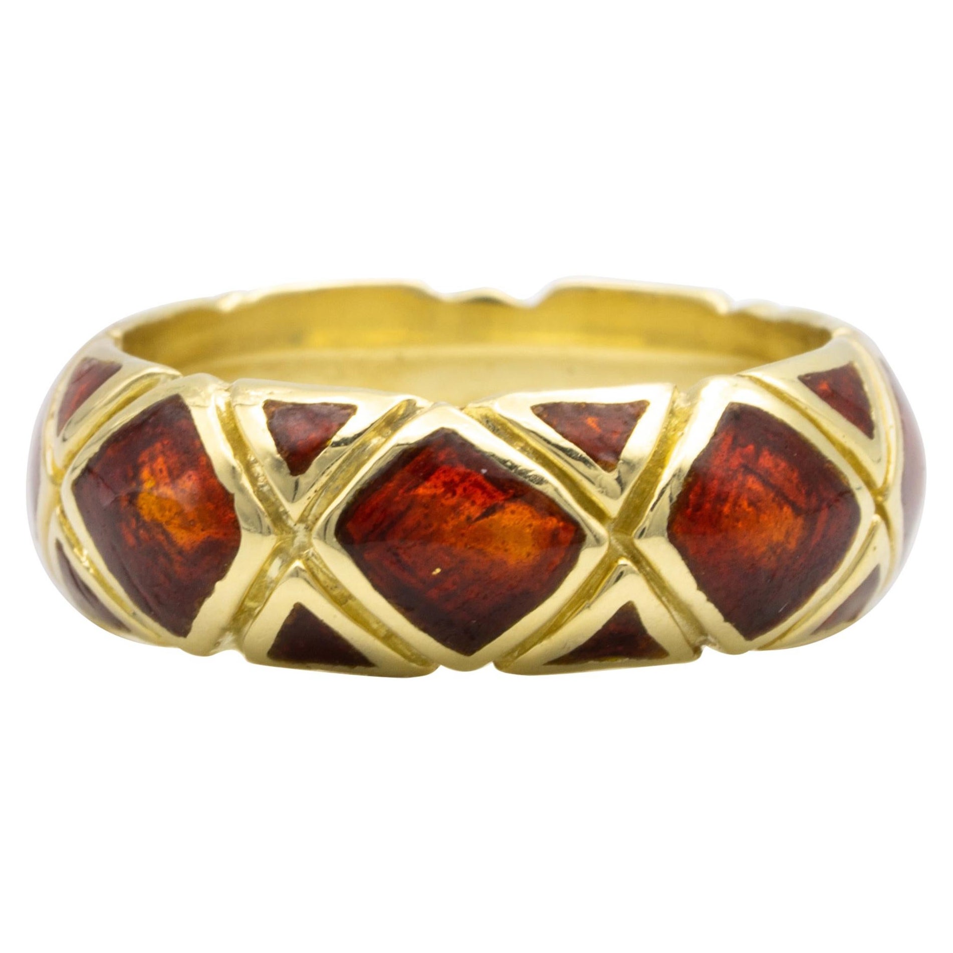 Tiffany & Co.  Vintage ring ,  finely crafted in 18 Karat yellow gold with a red enamel pattern design. Circa 1960's, Domed for a comfort fit.

Brand: Tiffany & Co. 
Ring Size 6 
Width: 6.5 mm 
Signed: TIFFANY  
Stamped: 18K  
Circa 1960's