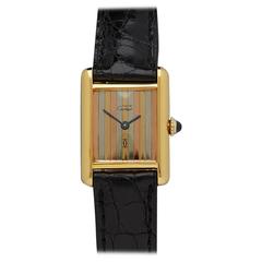 Montre-bracelet Must De Cartier Tank pour dame:: plaquée or jaune et argent sterling