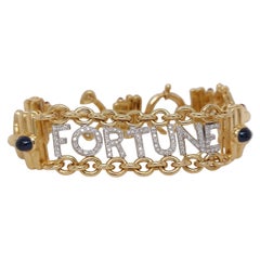 Mouawad Bracelet Fortune en or jaune 18 carats avec diamants, saphirs et émeraudes