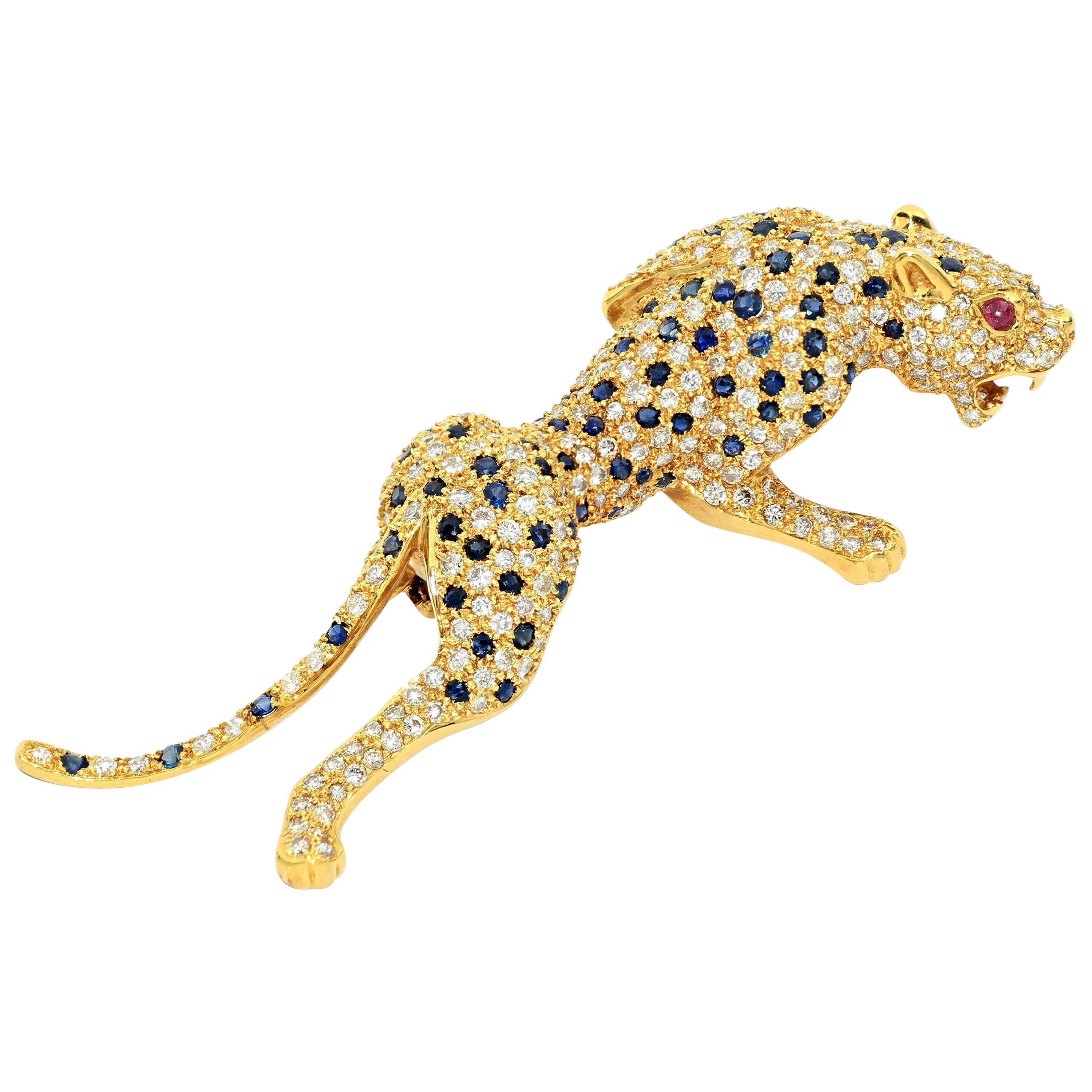 Pantherbrosche aus 18 Karat Gold mit Diamanten, Saphiren und Rubinen 