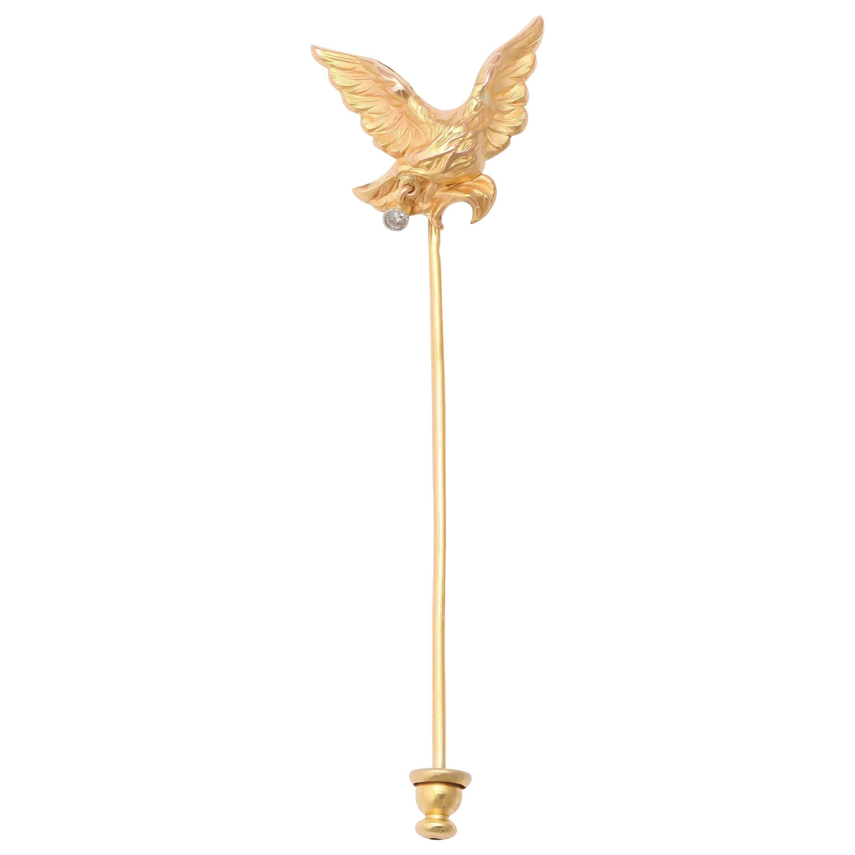 A Napoleonic eagle with outstretched wings clutching a small antique-cut diamond in its beak in 18k yellow gold.

Late 19th century, with French hallmark

2 3/4 in. (7 cm.) long; wingspan 7/8 in. (2.2 cm.)