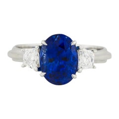3.53 Carat Oval Cut Sapphire Ring With Trapezoid Diamonds 18 Karat In Stock