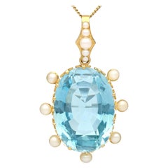 Pendentif ancien des années 1900 en or jaune avec aigue-marine et perle de 30,41 carats