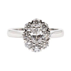 1.02 Carat Certified Oval Diamond Cluster Engagement Ring in 18 Carat White Gold