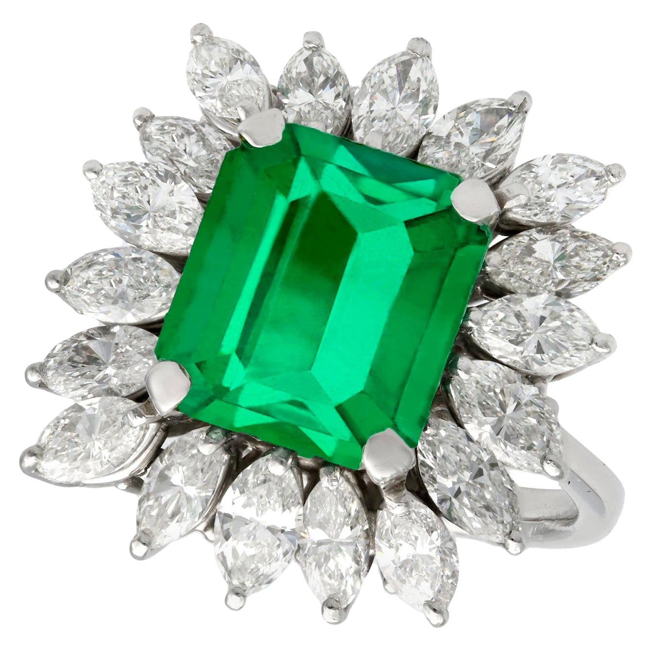 Vintage 4.30 Carat Emerald and 3.24 Carat Diamond White Gold Cluster Ring For Sale