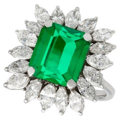 Retro 4.30 Carat Emerald and 3.24 Carat Diamond White Gold Cluster Ring