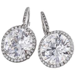 Modern GIA Cert diamond platinum solitaire earrings