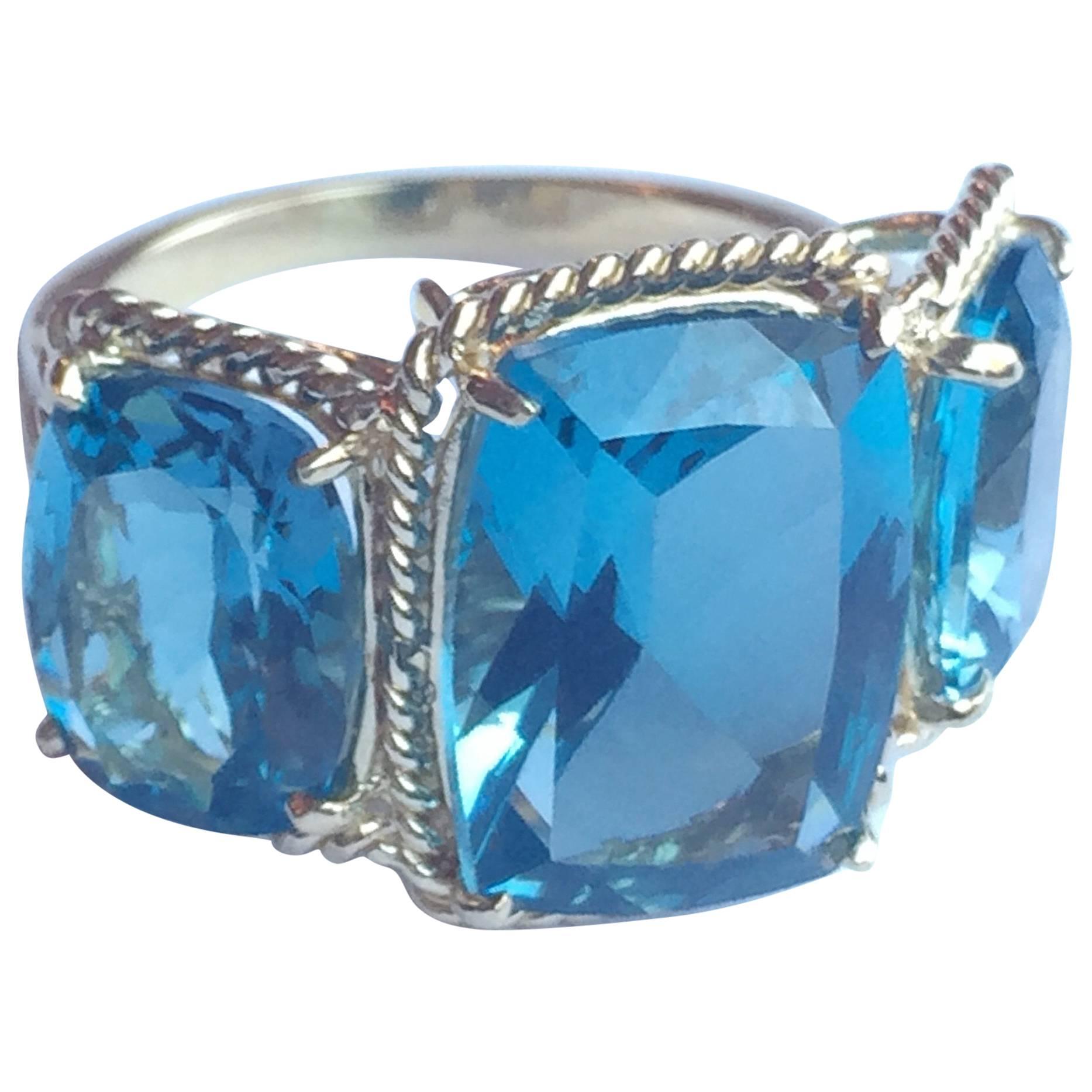 Three Stone Ring with Blue Topaz finished with Rope Twist Border
