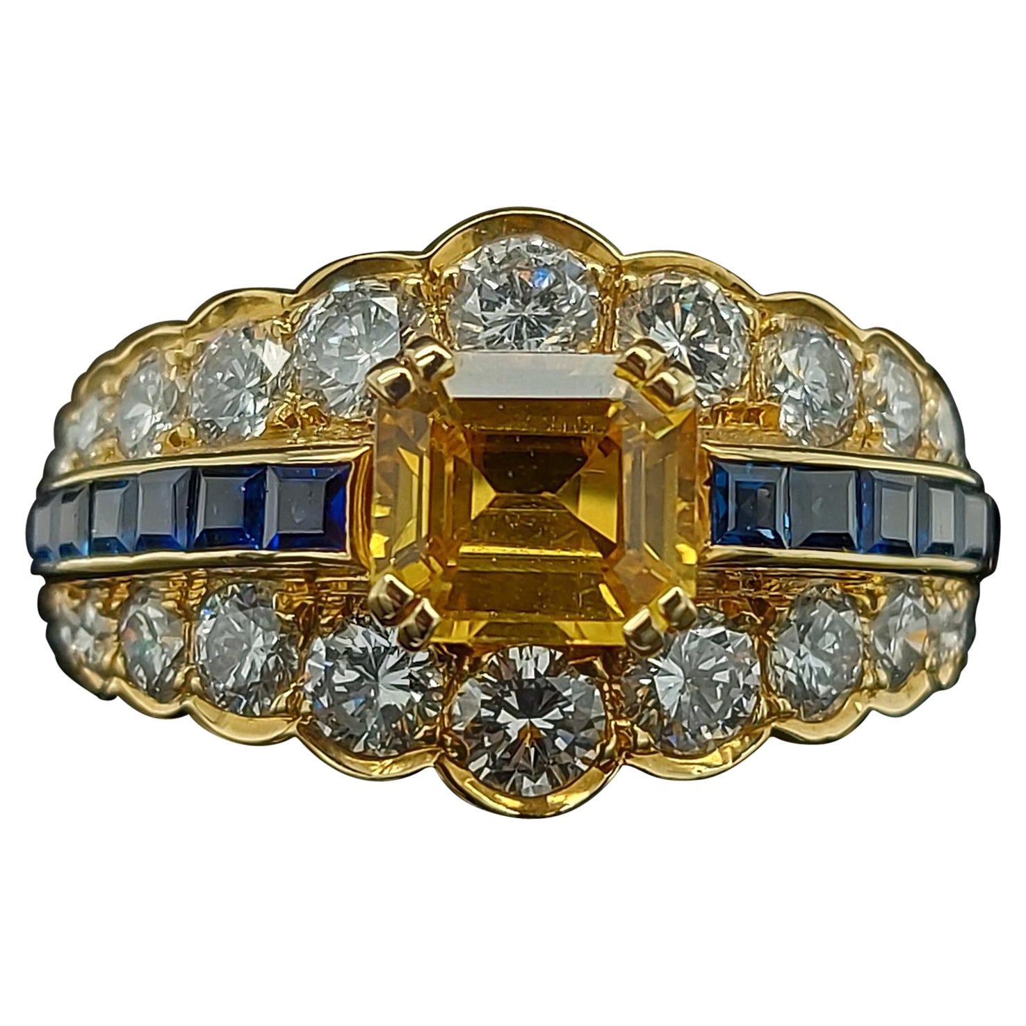 18 Karat Yellow Gold Ring with Large Yellow Sapphire Blue Sapphires and Diamonds For Sale