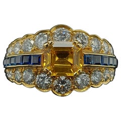 18 Karat Yellow Gold Ring with Large Yellow Sapphire Blue Sapphires and Diamonds