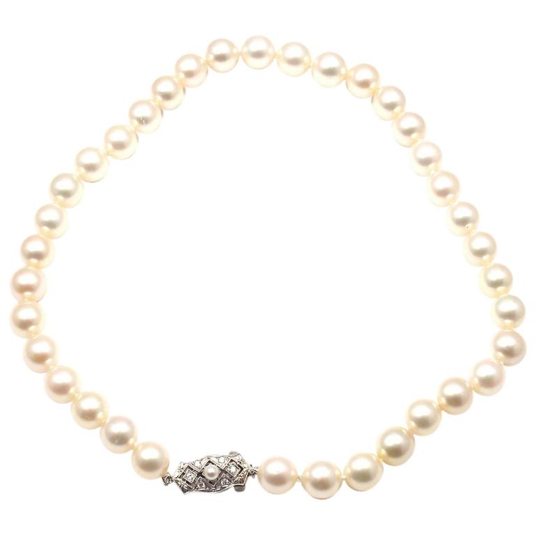 Mikimoto Triple Strand Pearl Necklace with Diamond Flower at 1stdibs