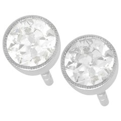 Round Diamond and White Gold Stud Earrings