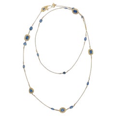 Collana di diamanti e acquamarina blu profondo in oro giallo 20 carati