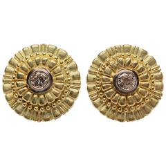 Round Gold Earrings centerd with Diamonds 10