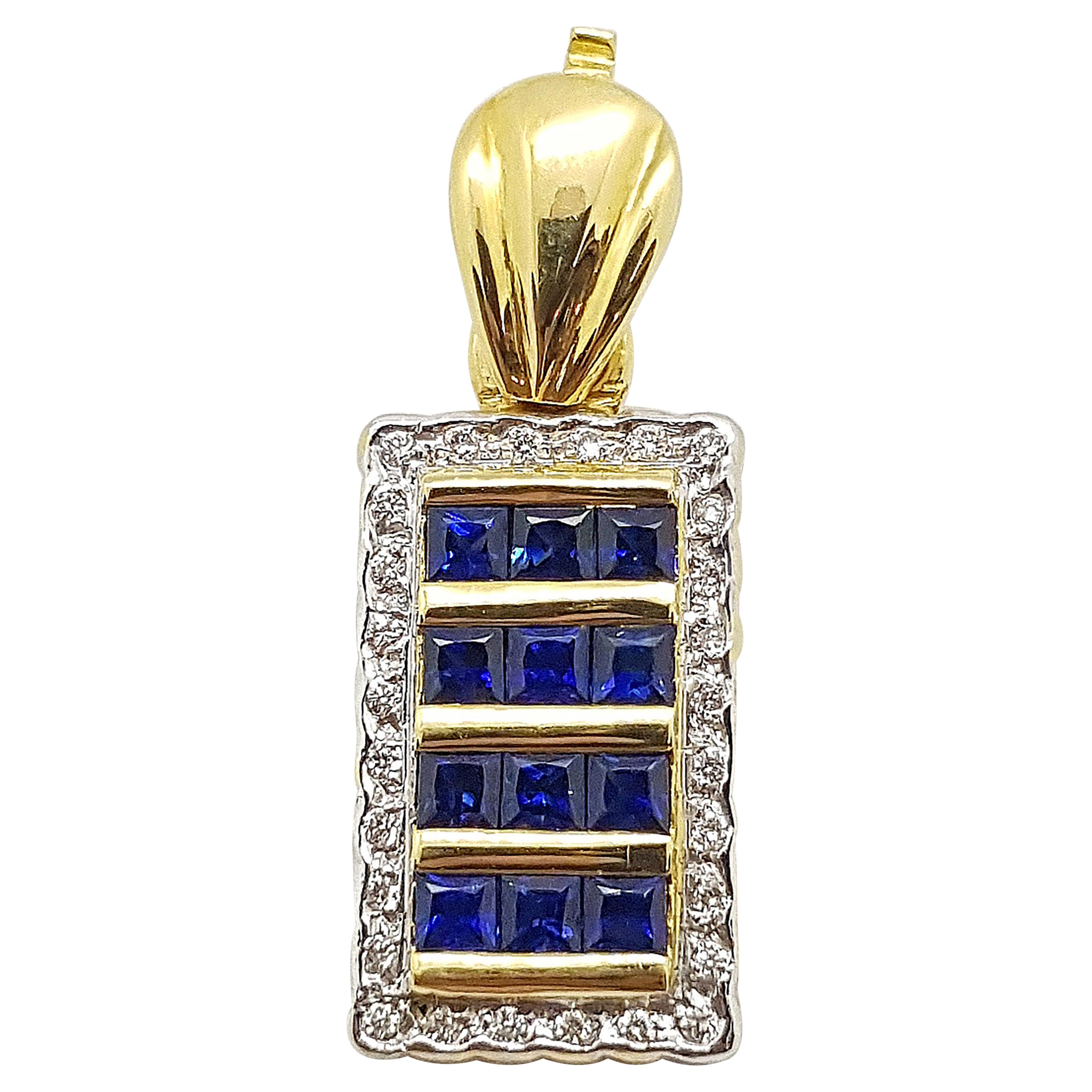 Pendentif en or 18 carats serti d'un saphir bleu et de diamants en vente