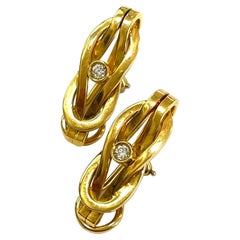 Boucles d'oreilles en or jaune 18 carats et diamants blancs