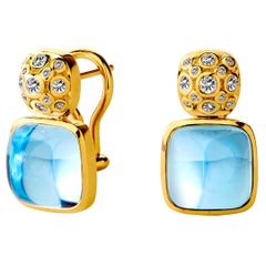 Syna-Ohrringe aus Gelbgold mit blauem Topas und Diamanten