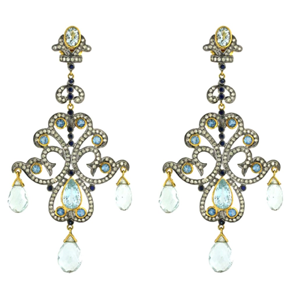 Boucles d'oreilles lustre aigue-marine et saphir bleu avec diamants en or et argent 14 carats