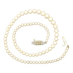 Collier de perles à un seul brin Fermoir en or avec diamant