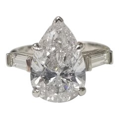 GIA Certified 3.95cts. Pear Shape Diamond Color E with 2 Baguettes .50pts