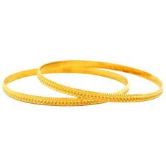 Pair of High-Karat Bright Cut Gold Bangles