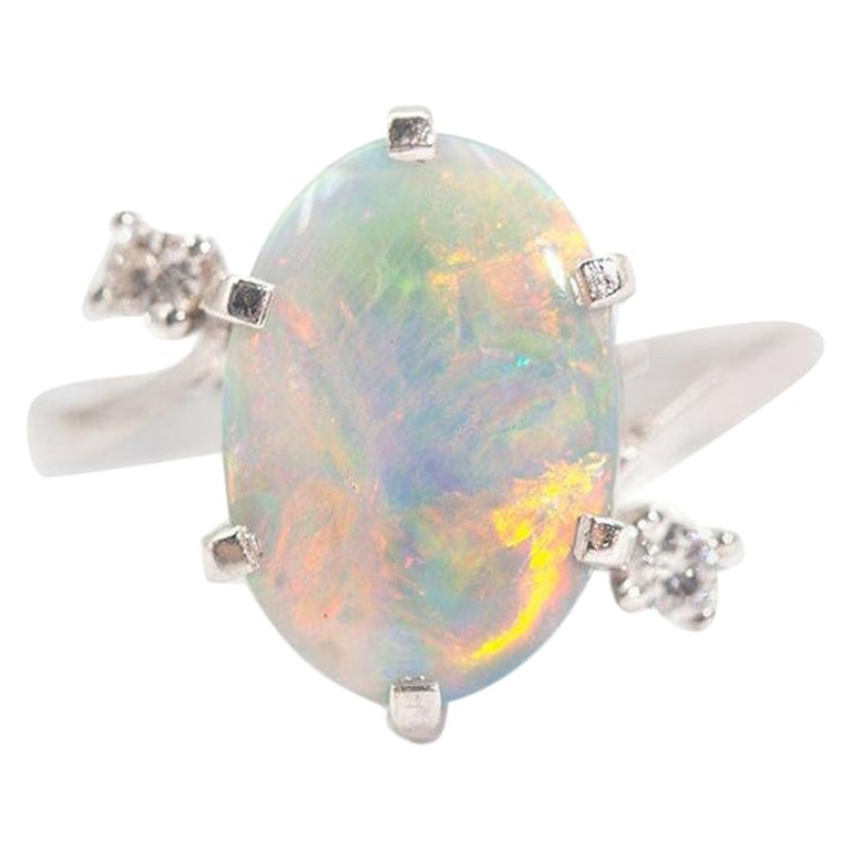 3.50 Carat Oval Solid Opal and Round Brilliant Vintage 18 Carat White Gold Ring