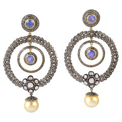 Pendants d'oreilles en or et argent avec perles et tanzanite en forme de tourbillon et diamants
