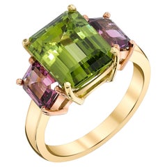 5.49 Carat Peridot and Rhodolite Garnet Three-Stone Ring in Yellow and Rose Gold