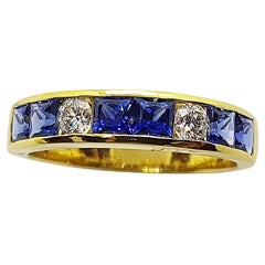 Bague en or 18 carats sertie d'un saphir bleu et de diamants