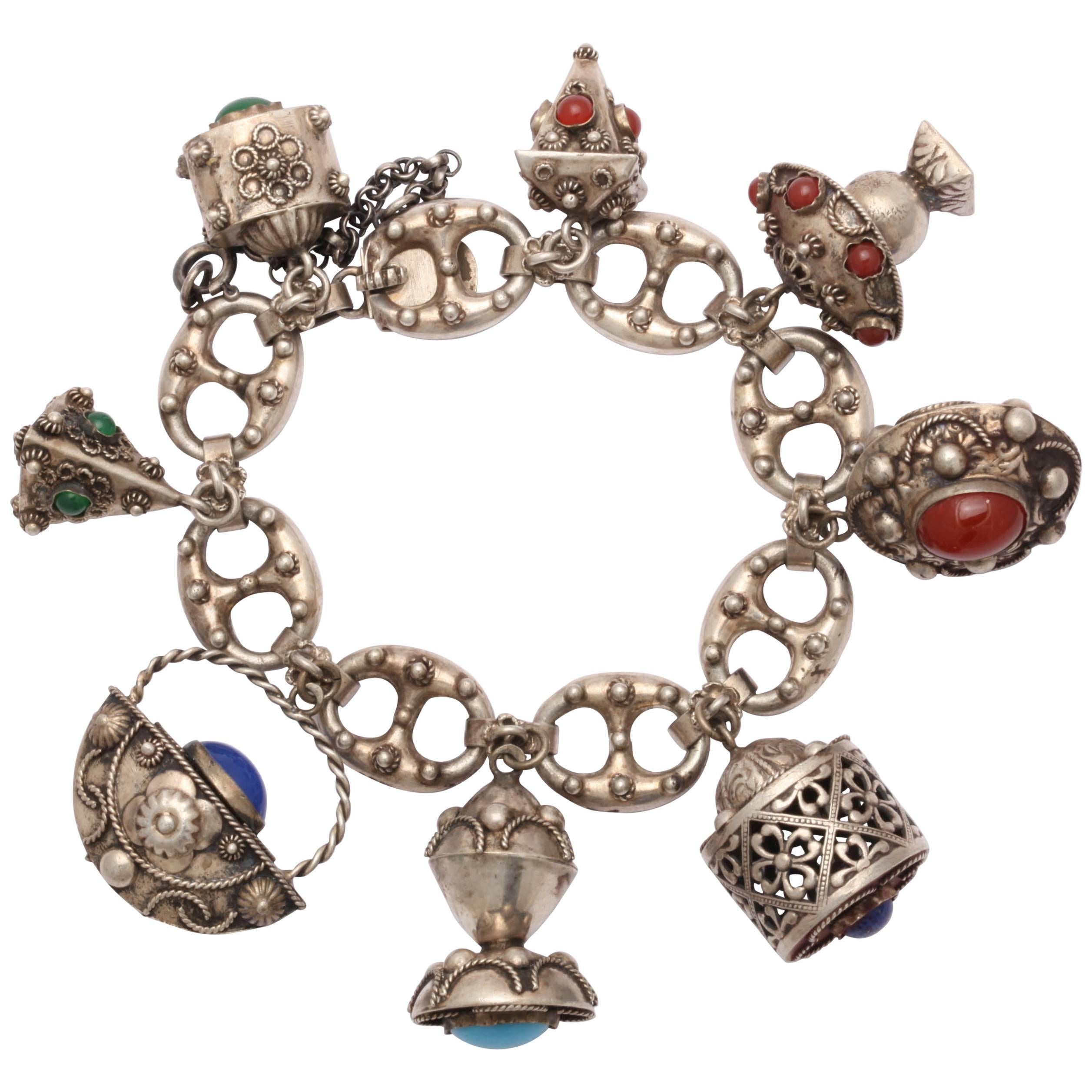 Vintage Chunky Eight-Charm Bracelet in Sterling Silver For Sale