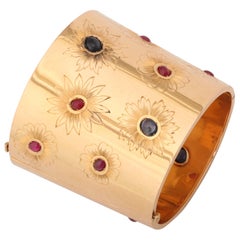 Sontuoso bracciale in oro con rubini e zaffiri