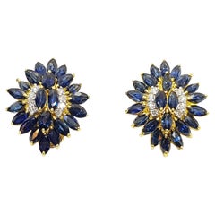 Ohrringe mit blauem Saphir und Diamanten in 18 Karat Goldfassungen