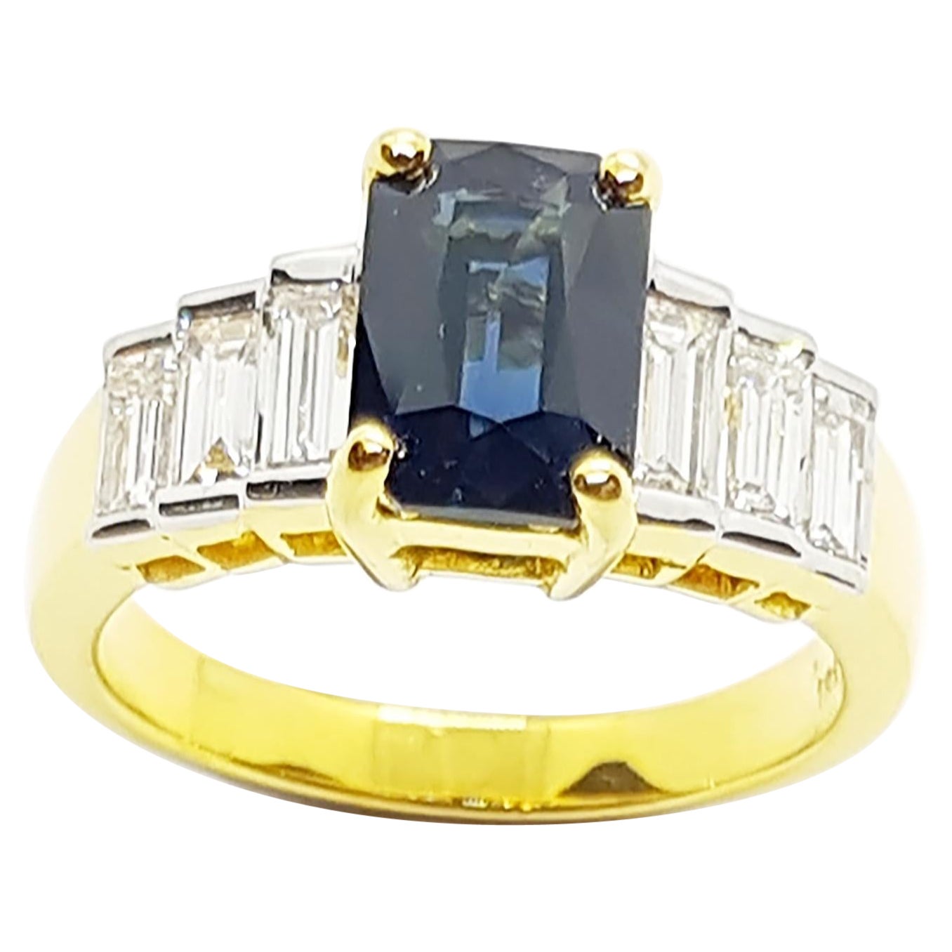 Bague en or 18 carats sertie d'un saphir bleu et de diamants