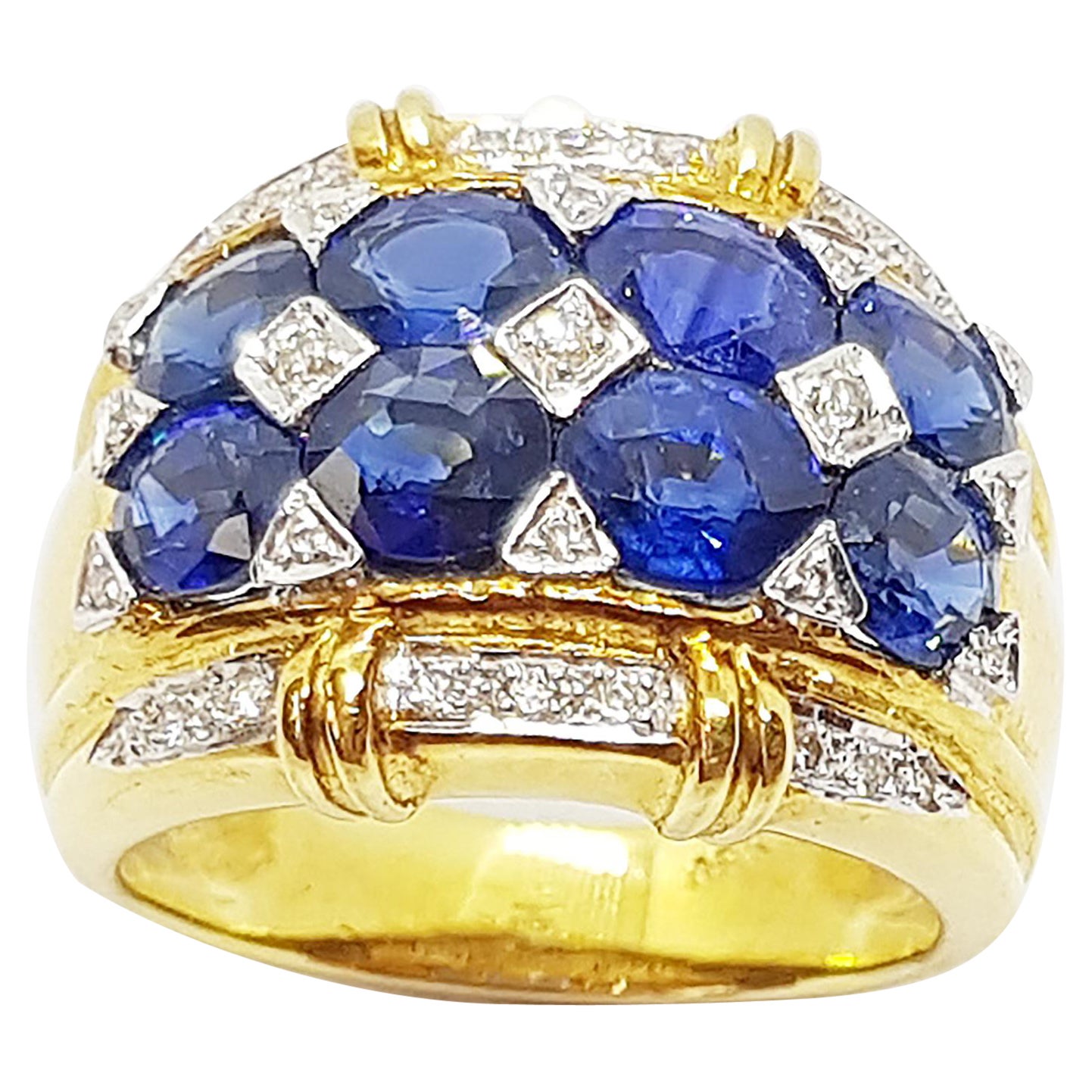 Bague en saphir bleu et diamants sertis en or 18 carats
