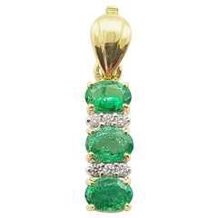 Emerald with Diamond Pendant Set in 18 Karat Gold Setting