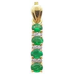 Emerald with Diamond Pendant Set in 18 Karat Gold Setting
