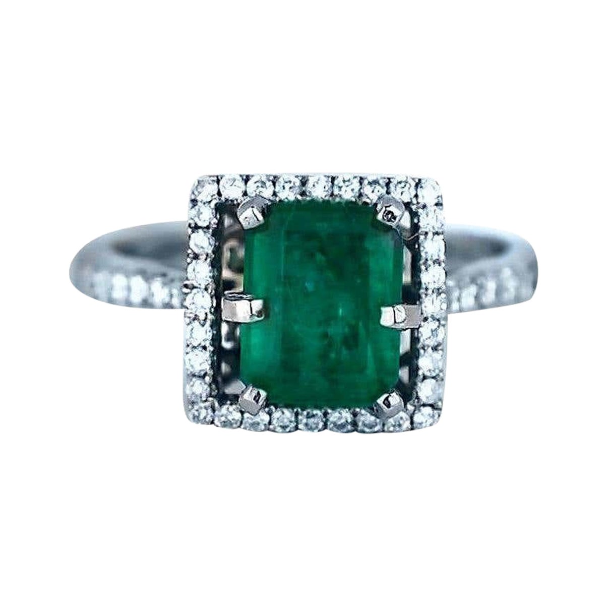2.48 Carat Colombian Emerald and Diamond Halo Ring For Sale