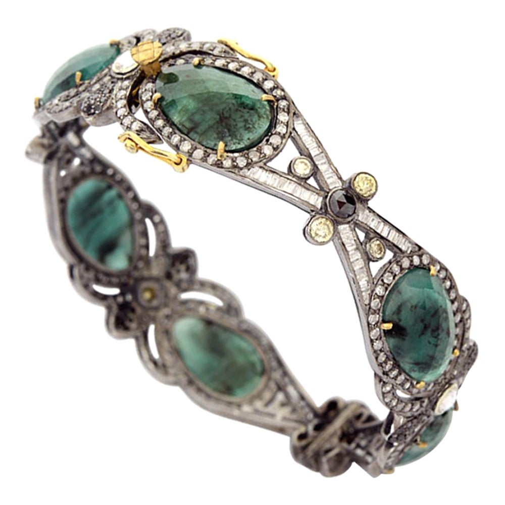 Vintage Style Designer Bangle with Green Emerald Surrounded by Pave Diamonds For Sale
