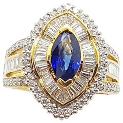 Bague en saphir bleu et diamants sertie d'or 18 carats