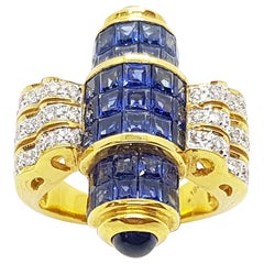 Bague en or 18 carats sertie d'un saphir bleu avec diamants et d'un saphir bleu en cabochon