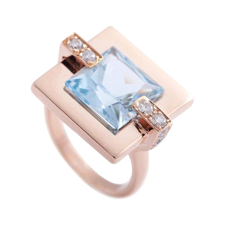 Modern 18 Karat Rose Gold Blue Topaz 0.27 Carat Diamonds Cocktail Design Ring For Sale