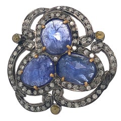 Anello di design con tanzanite e diamanti a fette in oro e argento 18 carati