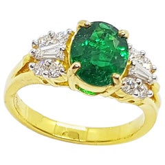 Emerald with Diamond Ring set in 18 Karat Gold Settings